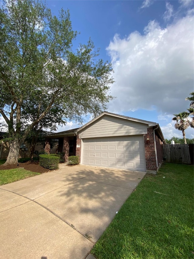 3006 Red Stag Pass, Missouri City, TX 77459 - ranch-style home with fence, brick siding, a garage, a front yard, and concrete driveway