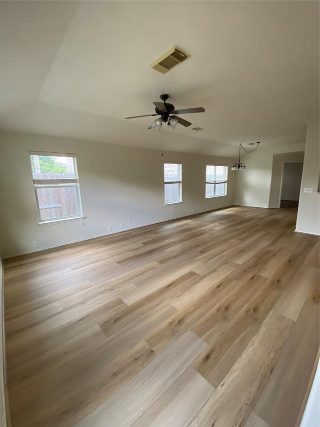 3006 Red Stag Pass, Missouri City, TX 77459 - spare room with visible vents, light wood-style floors, and plenty of natural light
