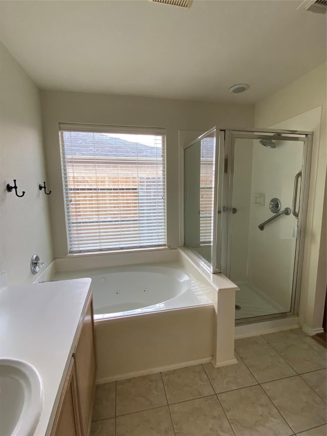 3006 Red Stag Pass, Missouri City, TX 77459 - full bath with vanity, a shower stall, tile patterned flooring, and a jetted tub