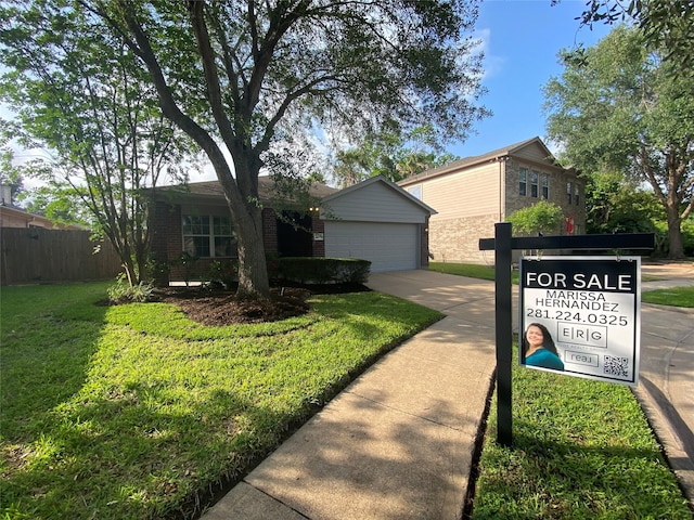 3006 Red Stag Pass, Missouri City, TX 77459 - single story home featuring driveway, brick siding, fence, a front lawn, and an attached garage