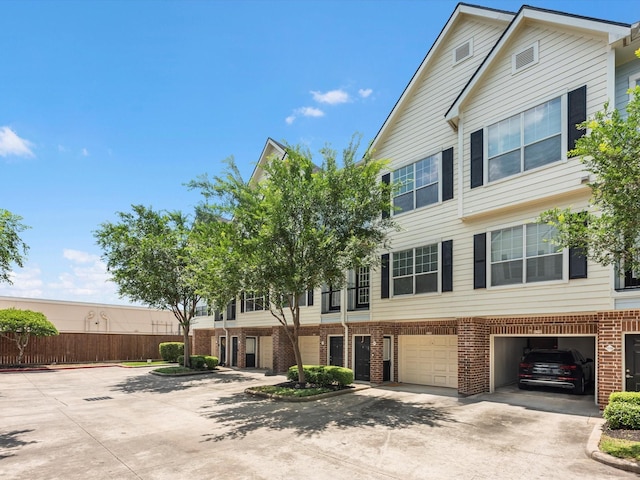 9200 Westheimer Rd Unit 1111, Houston, TX 77063 - multi unit property with brick siding, driveway, a garage, and fence