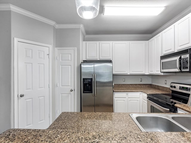 9200 Westheimer Rd Unit 1111, Houston, TX 77063 - kitchen featuring appliances with stainless steel finishes, ornamental molding, white cabinets, and a sink