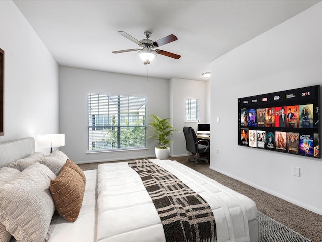 9200 Westheimer Rd Unit 1111, Houston, TX 77063 - bedroom featuring an office area, carpet, baseboards, and a ceiling fan