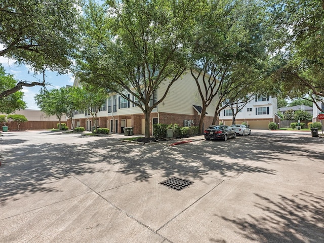 9200 Westheimer Rd Unit 1111, Houston, TX 77063 - view of front of home featuring brick siding and fence