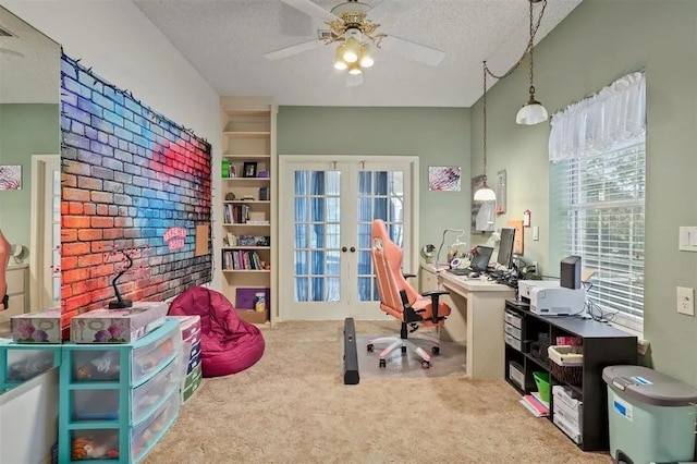 carpeted office featuring ceiling fan, french doors, and a textured ceiling