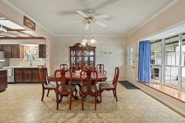 dining space with crown molding, a ceiling fan, wallpapered walls, and a textured ceiling
