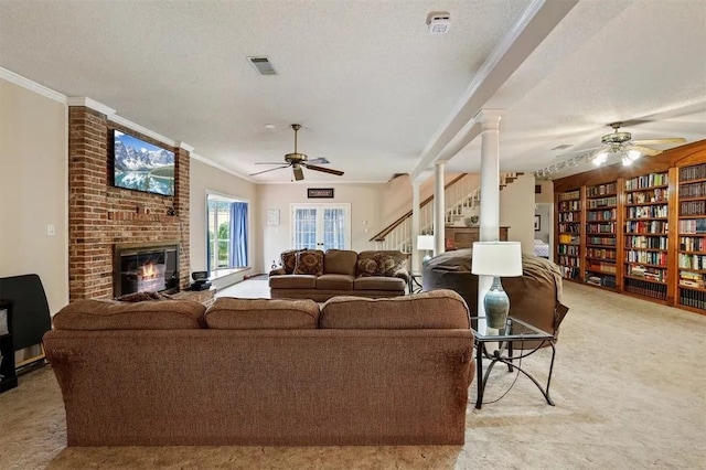 living area with light carpet, a ceiling fan, a brick fireplace, and visible vents