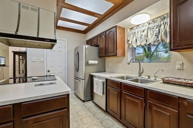kitchen featuring decorative backsplash, appliances with stainless steel finishes, a sink, light countertops, and light floors