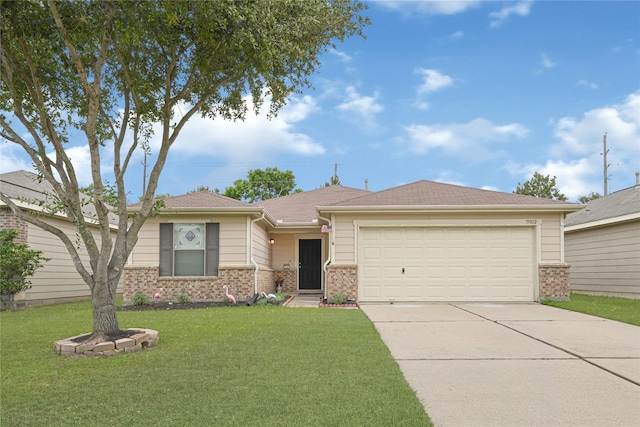 ranch-style house featuring brick siding, an attached garage, a front yard, and concrete driveway