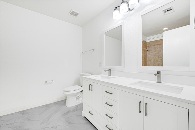 bathroom featuring toilet, visible vents, a sink, and marble finish floor