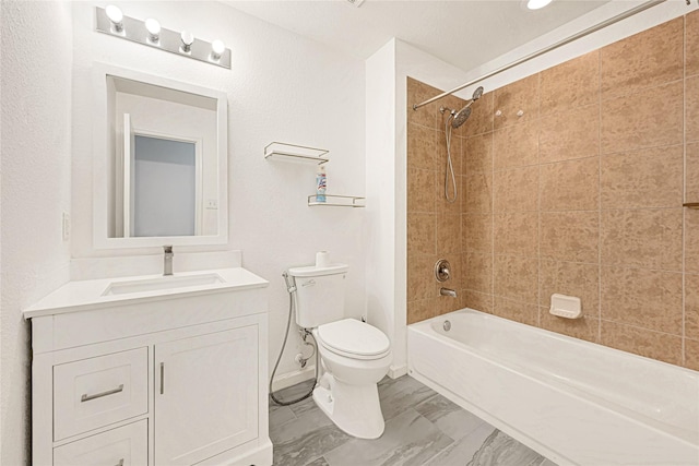 full bath with vanity, toilet, marble finish floor, baseboards, and shower / bathing tub combination