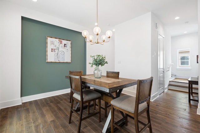 dining space with recessed lighting, dark wood-style flooring, baseboards, and a notable chandelier