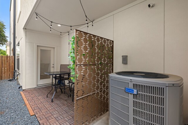 view of patio featuring fence and cooling unit