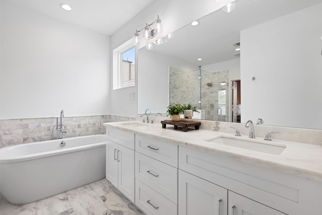 full bath featuring a sink, a shower stall, double vanity, and marble finish floor