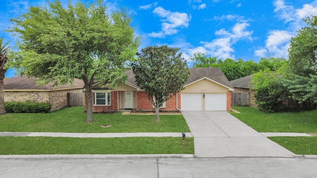view of front of property featuring a garage, a front lawn, fence, brick siding, and driveway