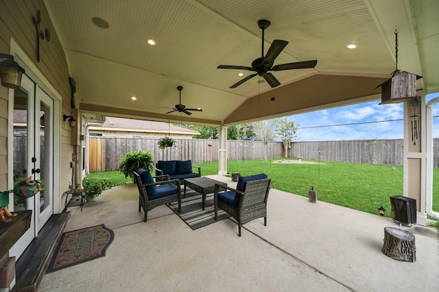 view of patio / terrace with a fenced backyard, ceiling fan, and outdoor lounge area