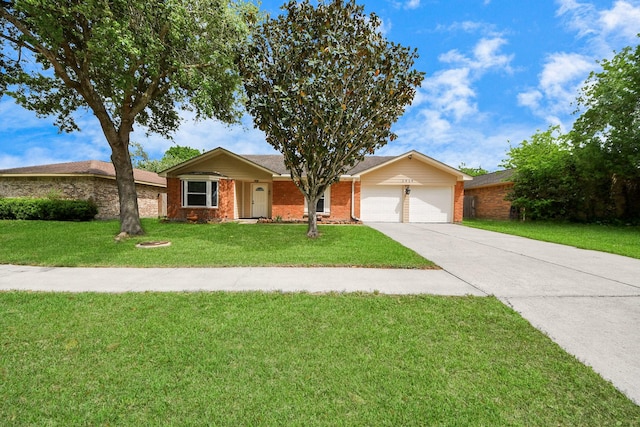 single story home featuring an attached garage, concrete driveway, a front yard, and brick siding