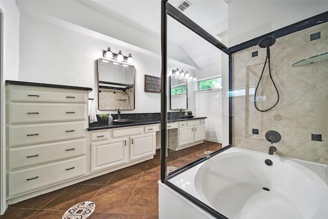 bathroom with a washtub, visible vents, tile patterned flooring, vanity, and lofted ceiling