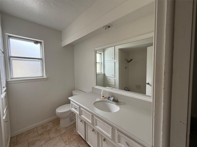 full bath featuring a textured ceiling, a shower, baseboards, vanity, and toilet
