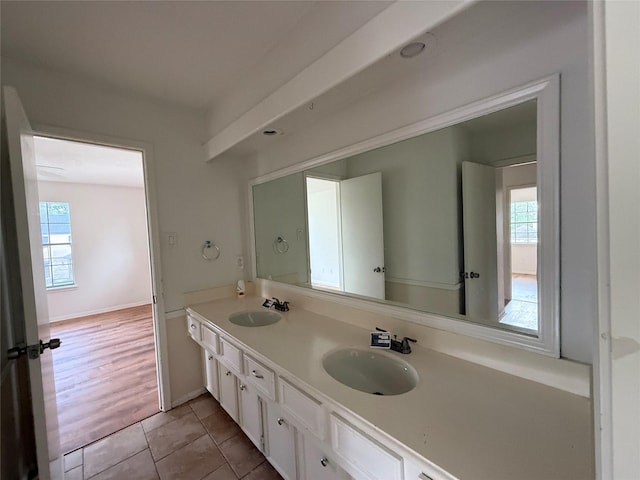 bathroom with plenty of natural light, a sink, and tile patterned floors