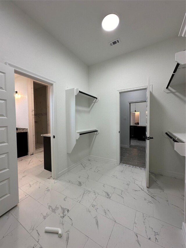 507 Kickapoo Dr, Anahuac, TX 77514 - walk in closet featuring visible vents and marble finish floor