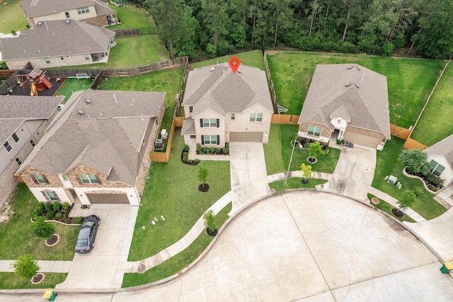 birds eye view of property with a residential view