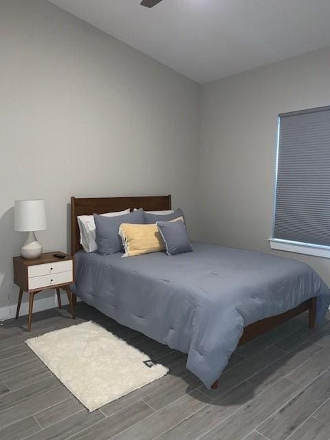 1019 E 37th St, Houston, TX 77022 - bedroom featuring wood finish floors and baseboards
