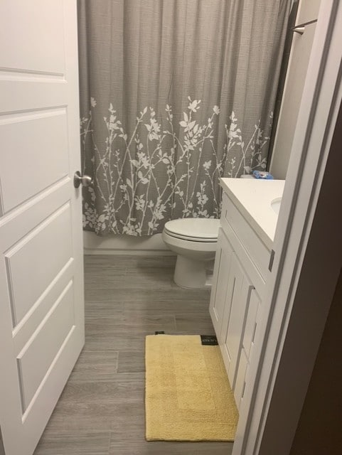 1019 E 37th St, Houston, TX 77022 - bathroom featuring toilet, wood finished floors, and vanity