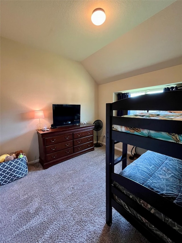 13882 Oak Manor Dr, Willis, TX 77318 - bedroom featuring baseboards, carpet flooring, a textured ceiling, and vaulted ceiling