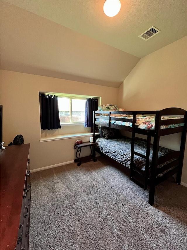 13882 Oak Manor Dr, Willis, TX 77318 - bedroom featuring carpet flooring, baseboards, visible vents, and vaulted ceiling