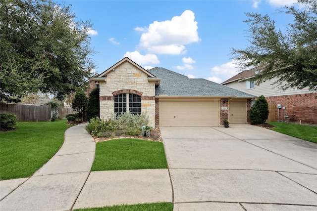 28406 Green Mill Ct, Spring, TX 77386 - view of front of house featuring roof with shingles, a front yard, fence, concrete driveway, and an attached garage