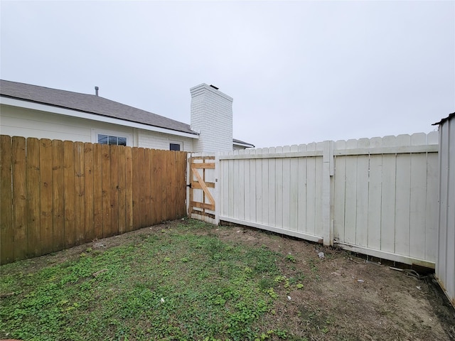 5703 Fraser Ave, Galveston, TX 77551 - view of yard with a gate and fence