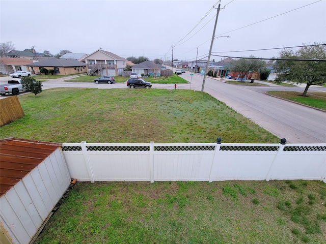 5703 Fraser Ave, Galveston, TX 77551 - view of yard featuring a residential view and fence private yard