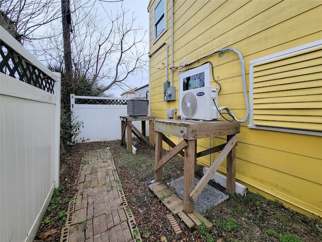 5703 Fraser Ave, Galveston, TX 77551 - view of yard featuring ac unit and fence