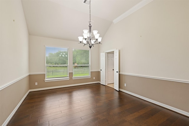 unfurnished room featuring baseboards, vaulted ceiling, an inviting chandelier, and wood finished floors