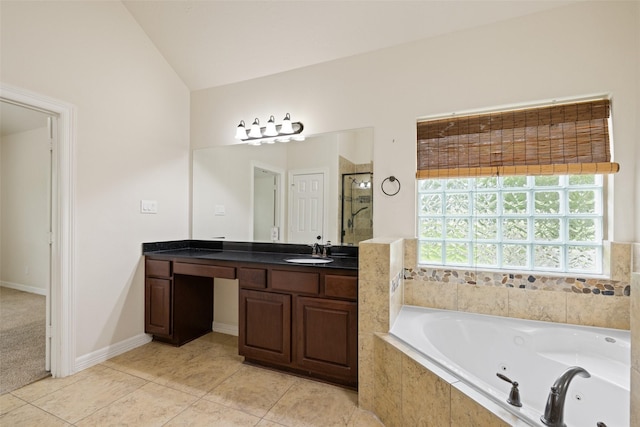 full bath featuring vanity, tile patterned floors, a tub with jets, a shower stall, and lofted ceiling