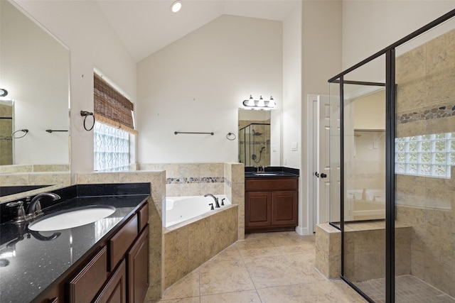 full bathroom featuring a sink, a bath, high vaulted ceiling, and a shower stall