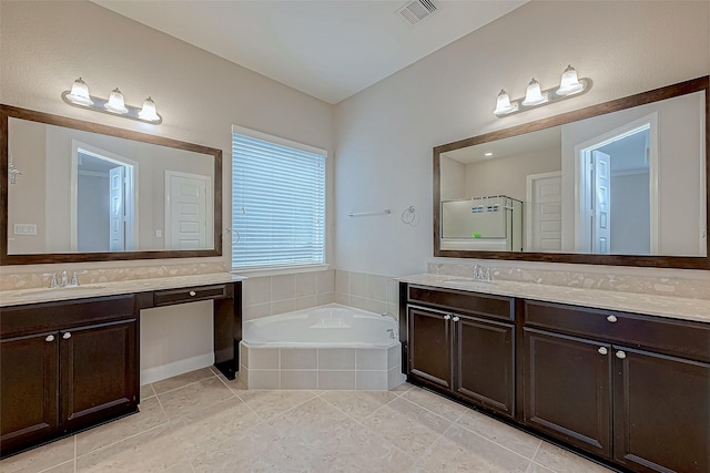 bathroom featuring visible vents, a shower stall, a sink, and a bath