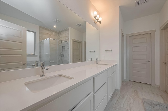 29407 Red Rocks Park Dr, Katy, TX 77494 - bathroom featuring visible vents, a sink, and a stall shower