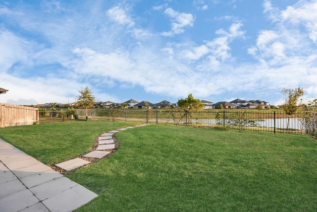 29407 Red Rocks Park Dr, Katy, TX 77494 - view of yard featuring a water view, a fenced backyard, and a residential view