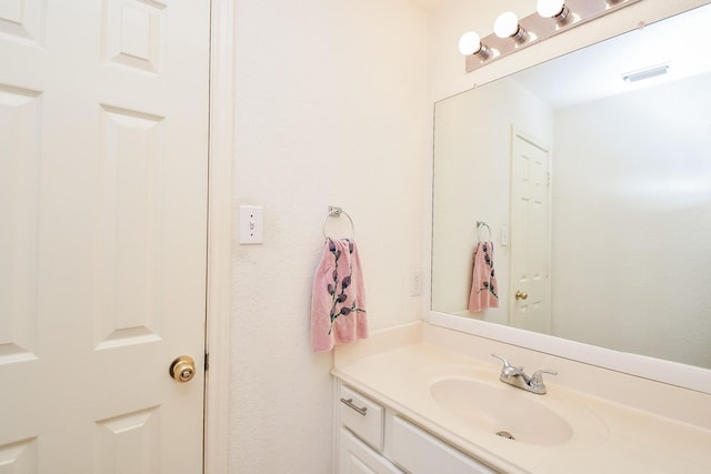 bathroom featuring vanity and visible vents