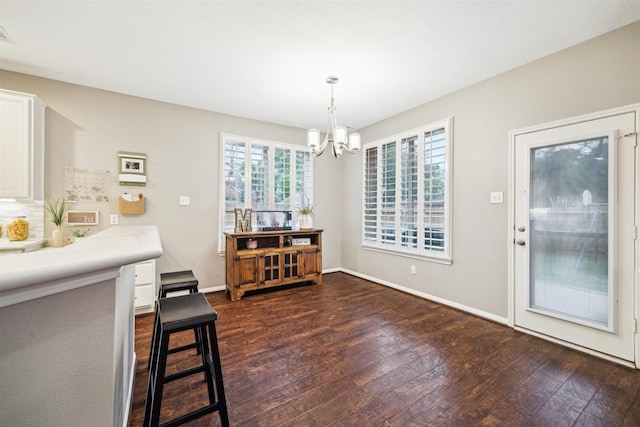 14718 Kings Head Dr, Houston, TX 77044 - dining room featuring baseboards, visible vents, dark wood-style floors, and a chandelier