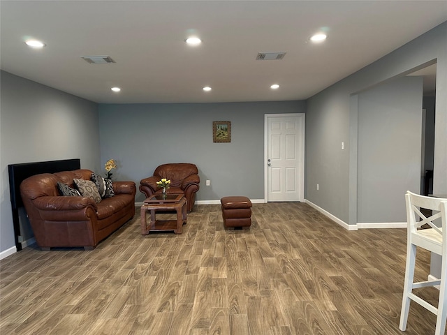 sitting room featuring recessed lighting, baseboards, visible vents, and wood finished floors