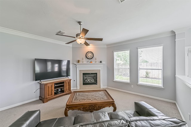 living area with crown molding and light carpet