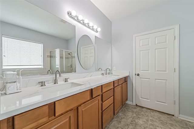 full bathroom featuring double vanity, a sink, a stall shower, and visible vents