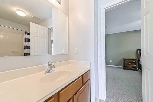 bathroom featuring baseboards, visible vents, a shower with shower curtain, and vanity