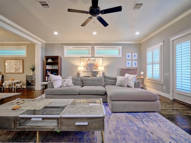 228 E Woodland St, Houston, TX 77009 - living room featuring crown molding, a ceiling fan, visible vents, and wood finished floors