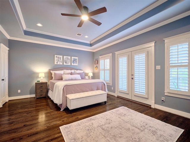 228 E Woodland St, Houston, TX 77009 - bedroom featuring a tray ceiling, multiple windows, visible vents, and access to exterior