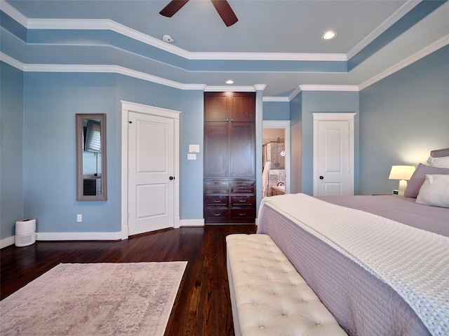 228 E Woodland St, Houston, TX 77009 - bedroom featuring dark wood-style flooring, a raised ceiling, baseboards, and recessed lighting
