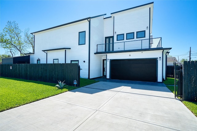 2420 Sumpter St, Houston, TX 77026 - view of front of home featuring a garage, a front lawn, fence, a balcony, and concrete driveway